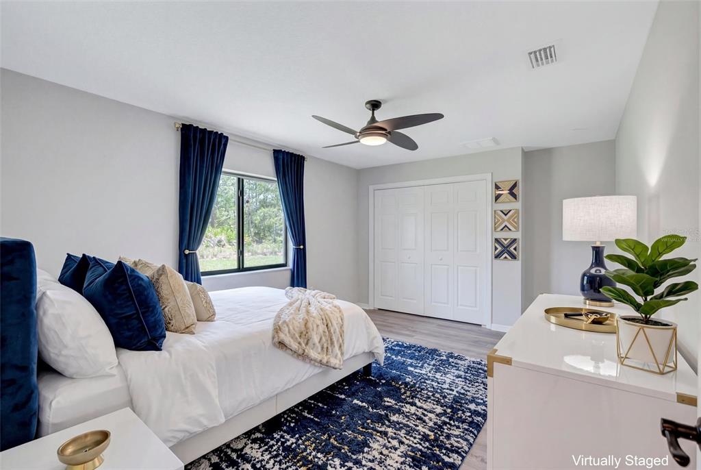 13362 Downy Woodpecker Road Weeki Wachee, FL 34614 - Photo 13 of 26 a living room with a bed furniture and a window