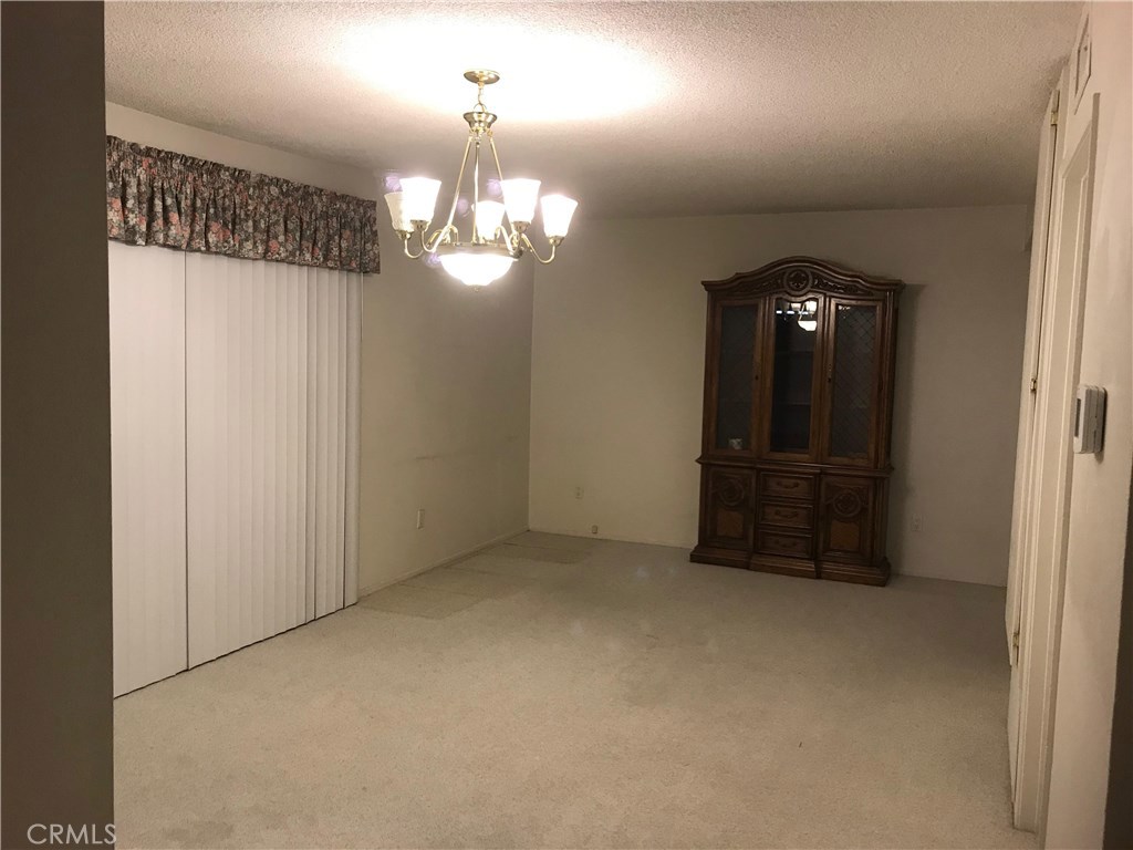 1203 Edgewood Lane Upland, CA 91786 - Photo 4 of 11 en view of a chandelier in big room and chandelier