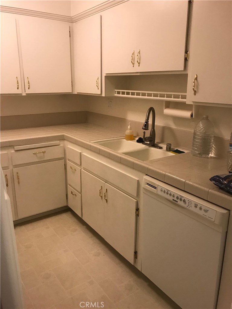 1203 Edgewood Lane Upland, CA 91786 - Photo 6 of 11 a kitchen with a sink and cabinets