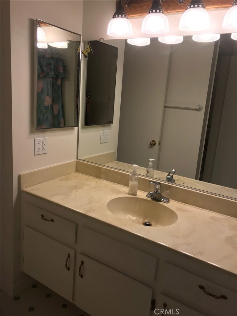 1203 Edgewood Lane Upland, CA 91786 - Photo 8 of 11 a bathroom with a sink and mirror