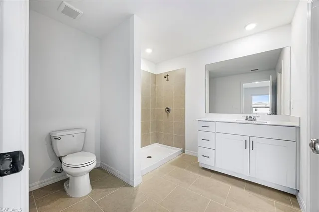 a bathroom with a sink a shower and a mirror
