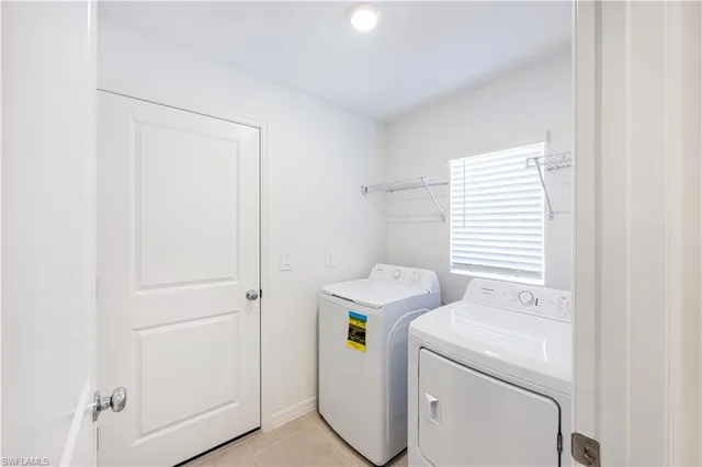 a view of storage and utility room with washer and dryer
