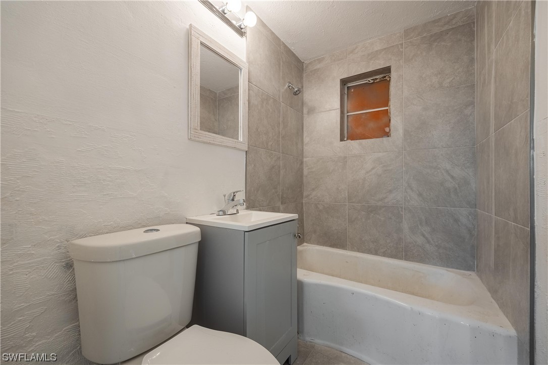 1338 Old Bridge Road North Fort Myers, FL 33917 - Photo 12 of 33 a bathroom with a sink a toilet and shower