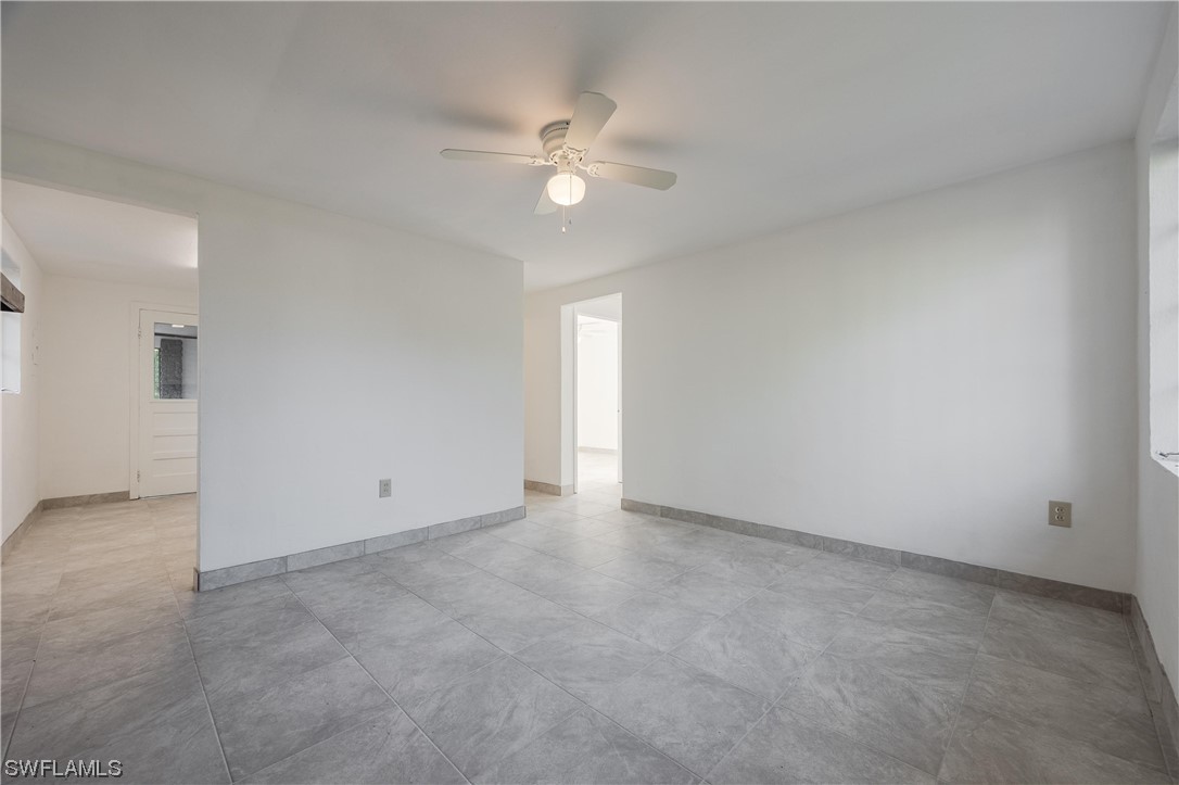 1338 Old Bridge Road North Fort Myers, FL 33917 - Photo 13 of 33 an empty room with a fan & a window