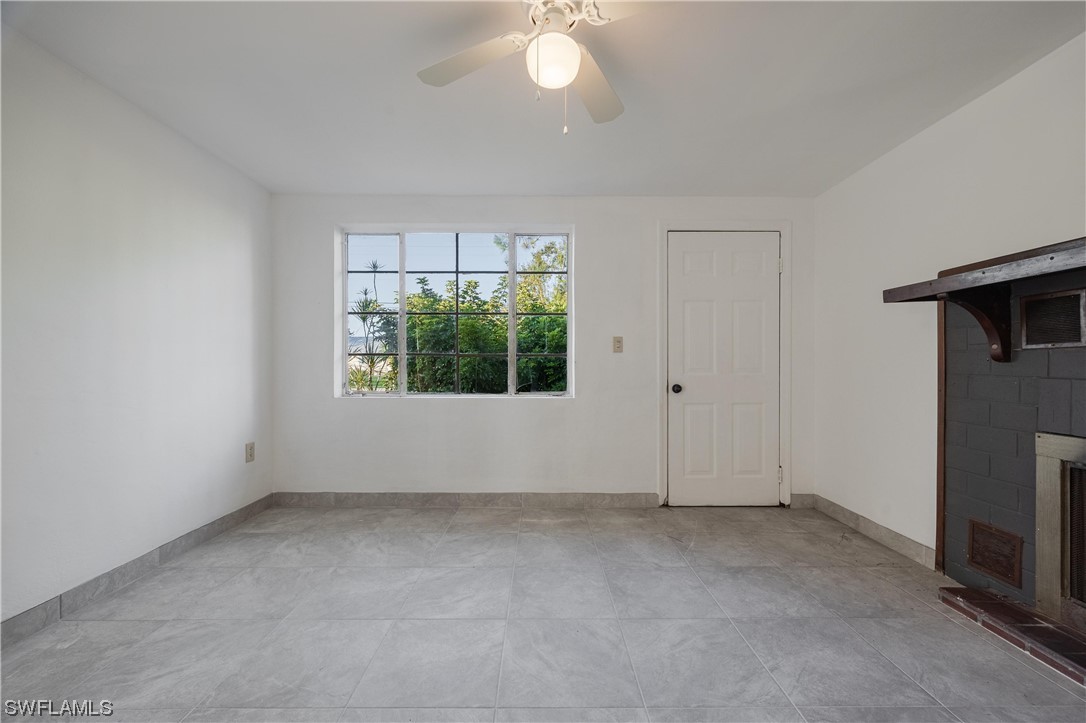 1338 Old Bridge Road North Fort Myers, FL 33917 - Photo 14 of 33 an empty room with a fireplace