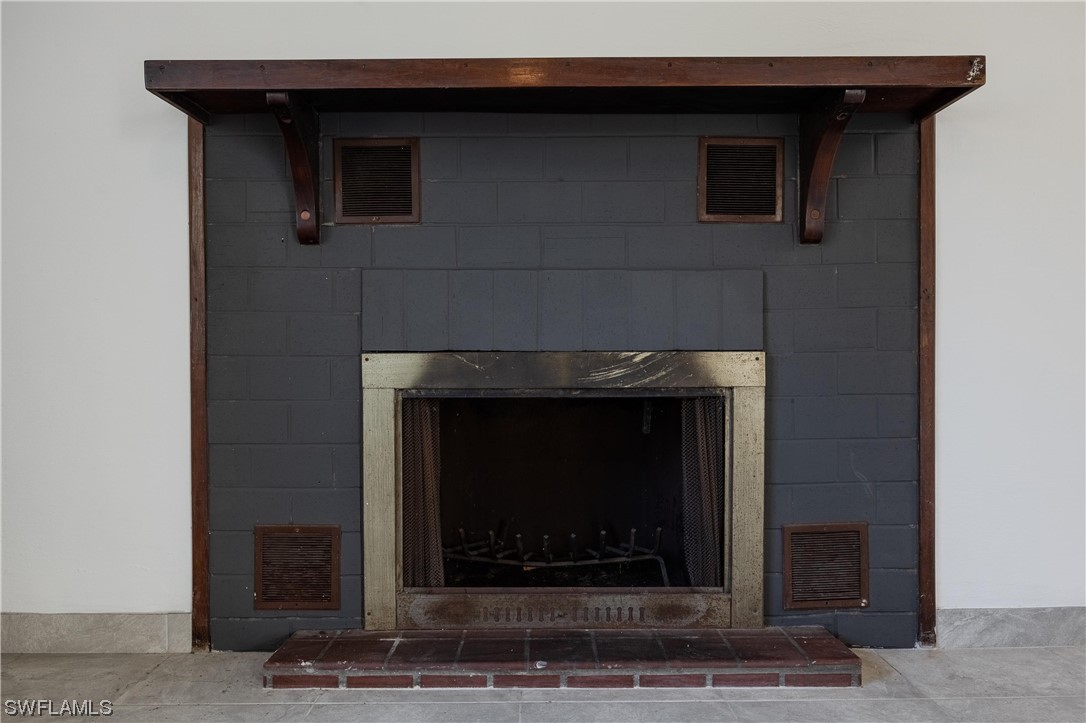 1338 Old Bridge Road North Fort Myers, FL 33917 - Photo 21 of 33 a fireplace with a hallway