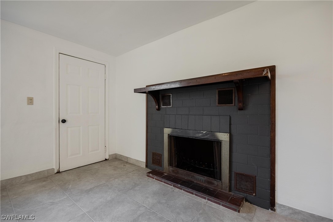 1338 Old Bridge Road North Fort Myers, FL 33917 - Photo 25 of 33 a living room with a fireplace