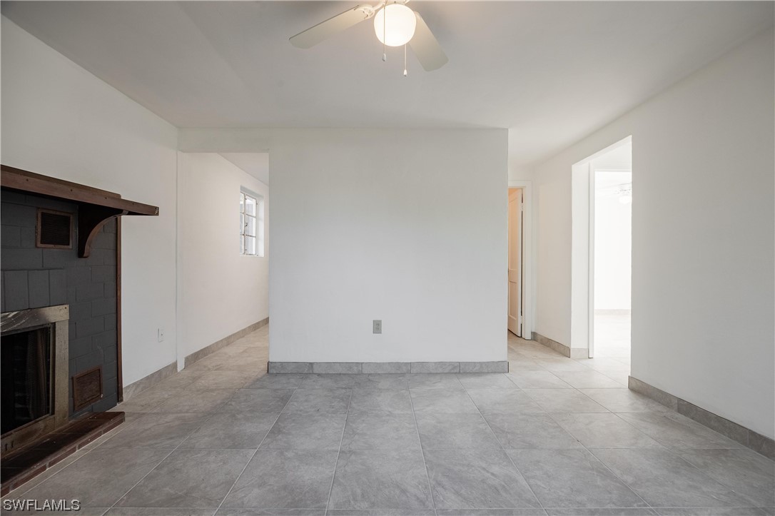 1338 Old Bridge Road North Fort Myers, FL 33917 - Photo 26 of 33 an empty room with a fireplace