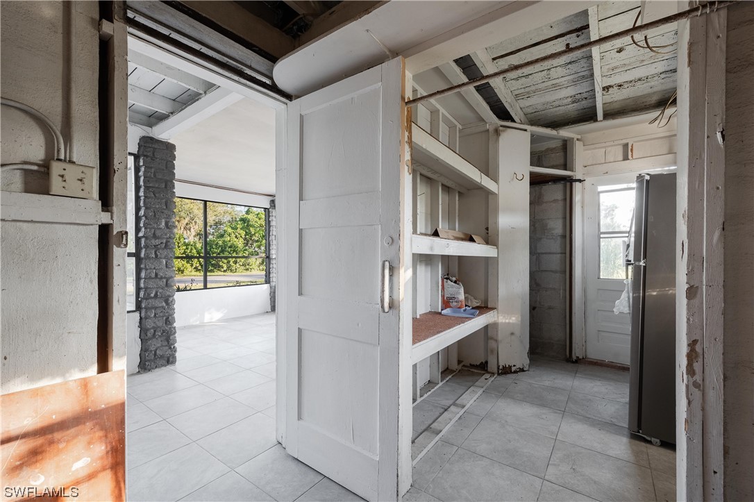 1338 Old Bridge Road North Fort Myers, FL 33917 - Photo 29 of 33 a view of kitchen and utility room with closet