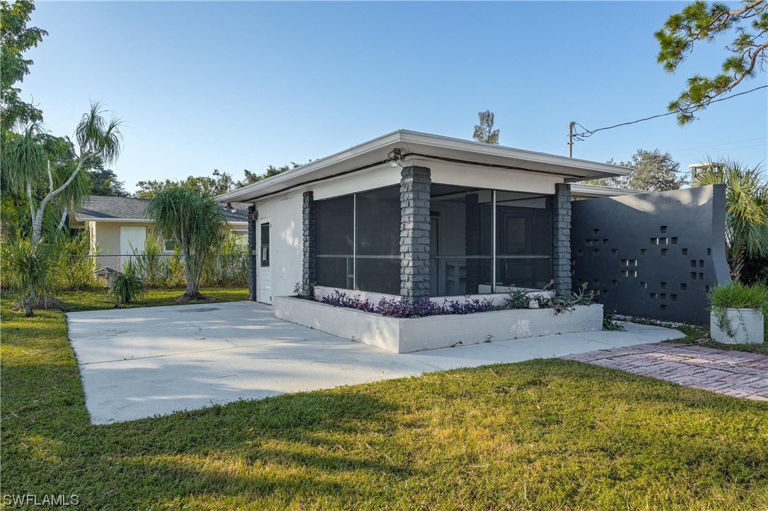 1338 Old Bridge Road North Fort Myers, FL 33917 - Photo 4 of 33 a view of the house with a yard