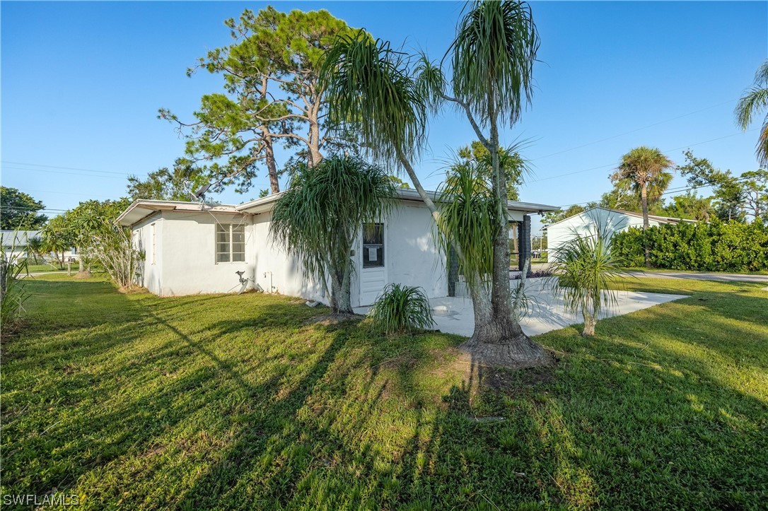 1338 Old Bridge Road North Fort Myers, FL 33917 - Photo 5 of 33 a view of a house with a yard