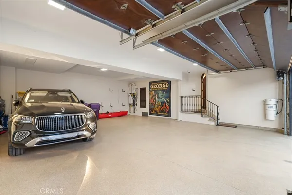 a view of a livingroom with furniture and chandelier wooden floor