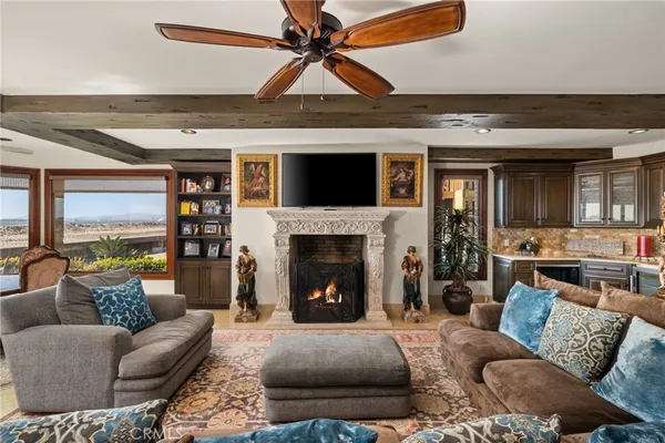 a living room with furniture a rug and a table