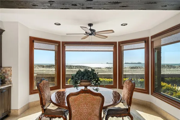 a living room with furniture a rug and a large window
