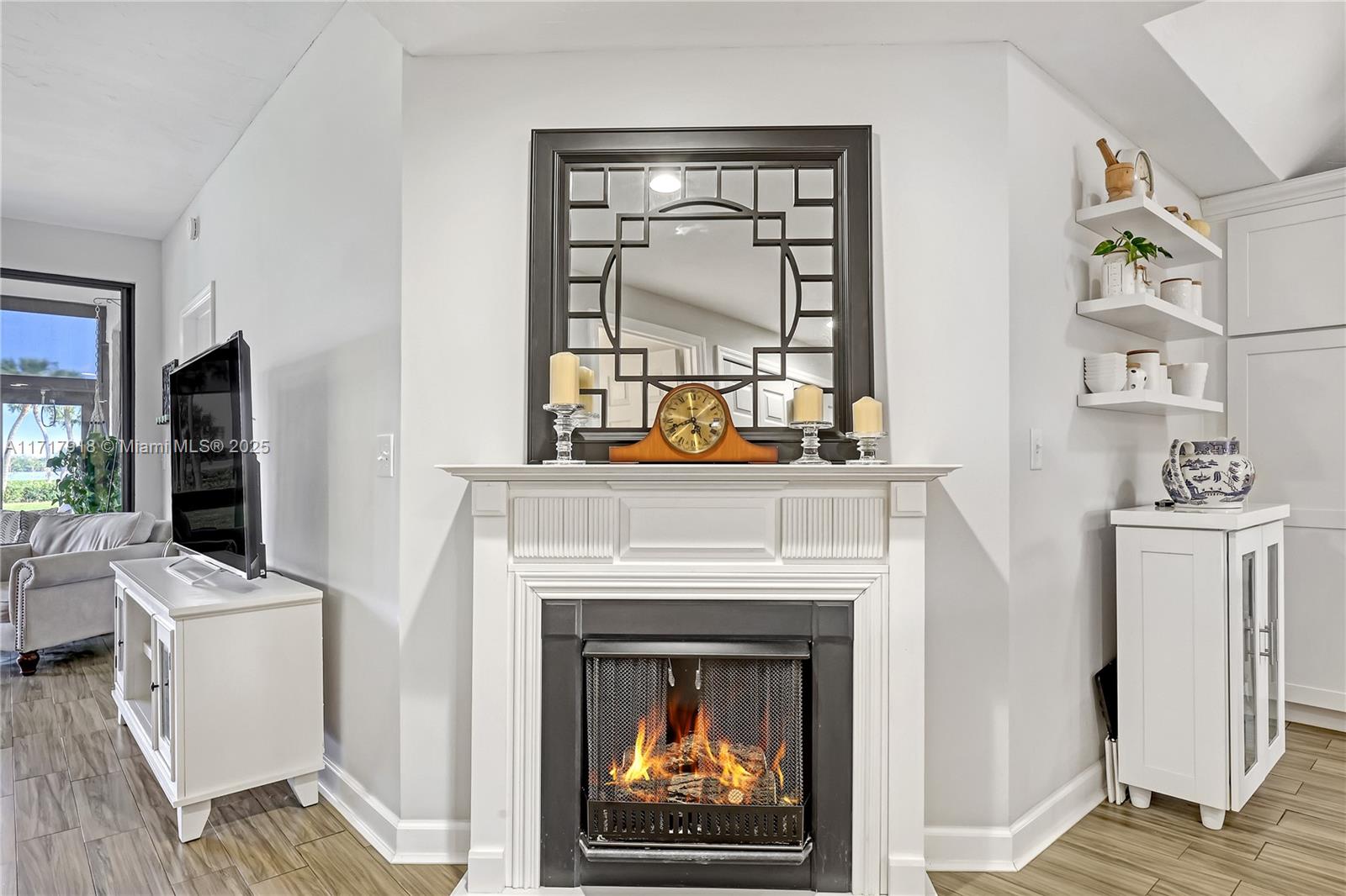6102 Southeast Landing Way, Unit 2 Stuart, FL 34997 - Photo 11 of 44 a living room with furniture and a fireplace