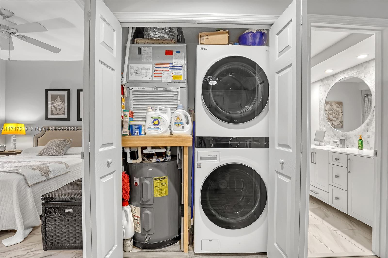 6102 Southeast Landing Way, Unit 2 Stuart, FL 34997 - Photo 12 of 44 a view of a bedroom with washer and dryer
