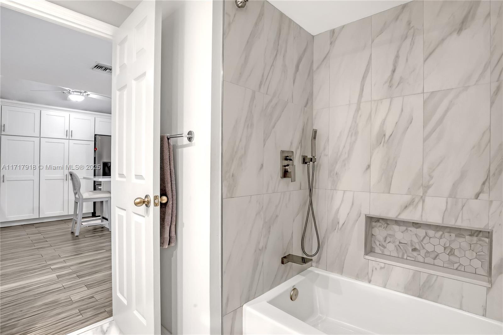 6102 Southeast Landing Way, Unit 2 Stuart, FL 34997 - Photo 16 of 44 a bathroom with a tub a sink and a shower