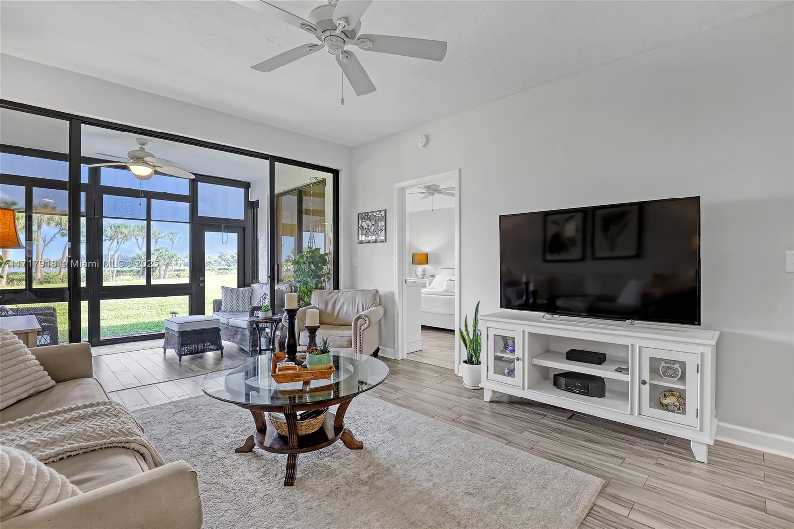 6102 Southeast Landing Way, Unit 2 Stuart, FL 34997 - Photo 19 of 44 a living room with furniture and a flat screen tv