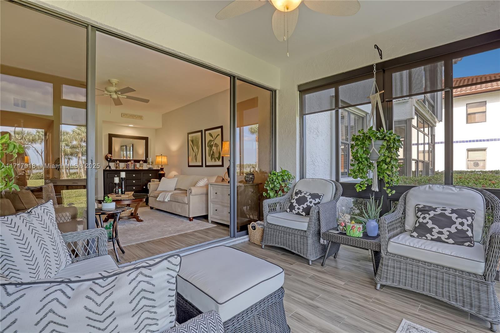 6102 Southeast Landing Way, Unit 2 Stuart, FL 34997 - Photo 22 of 44 a living room with furniture and a large window