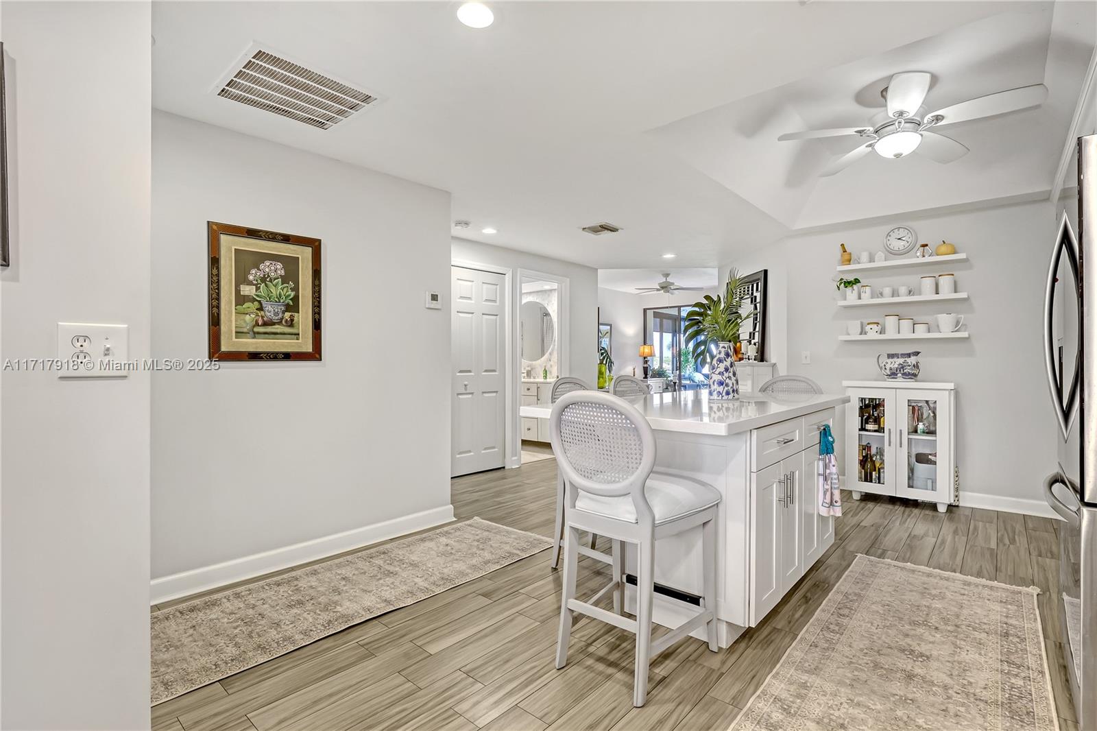 6102 Southeast Landing Way, Unit 2 Stuart, FL 34997 - Photo 10 of 44 a dining room with furniture and window