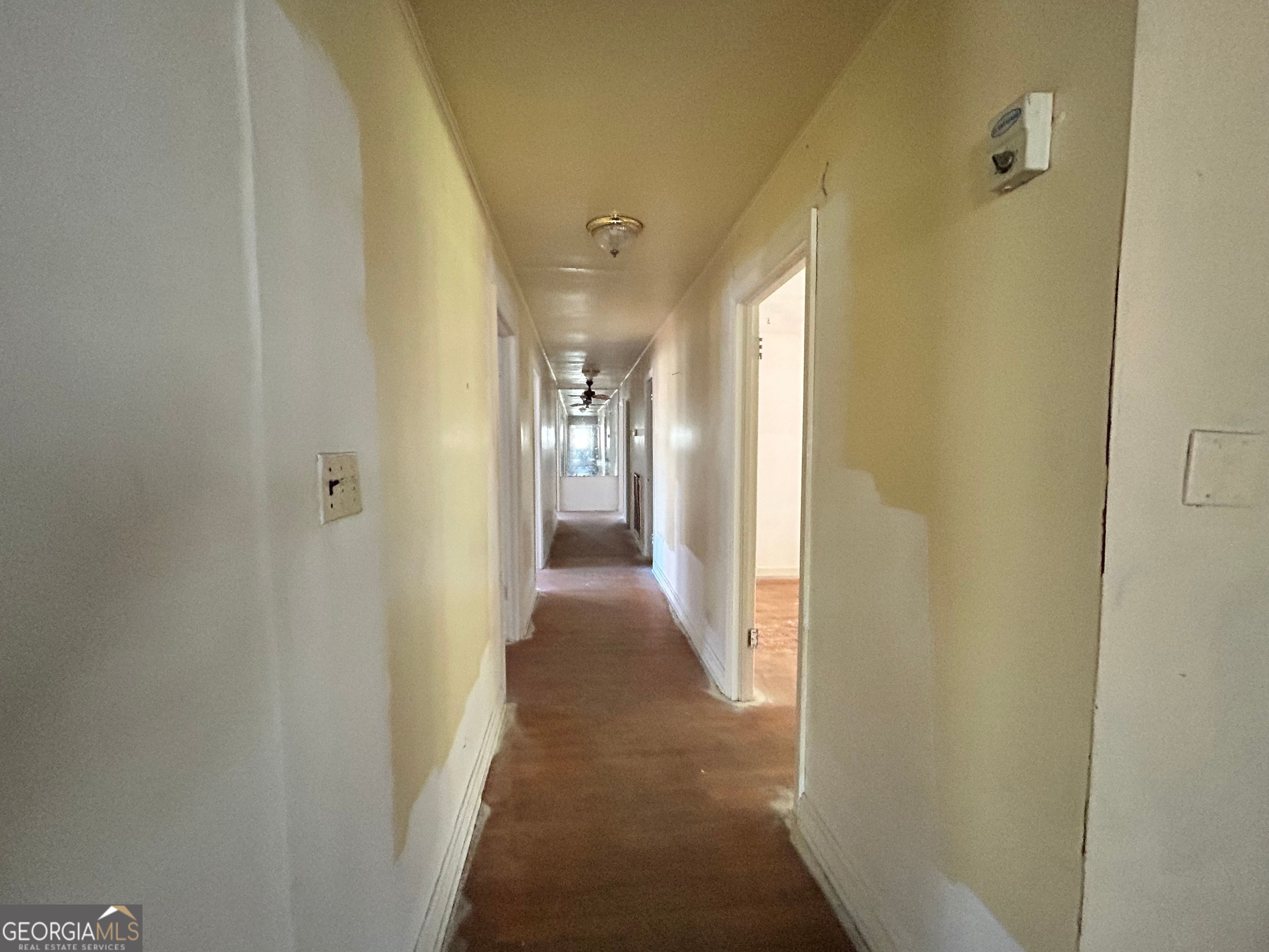 806 Magnolia Drive Macon, GA 31217 - Photo 12 of 25 a view of a hallway with wooden floor