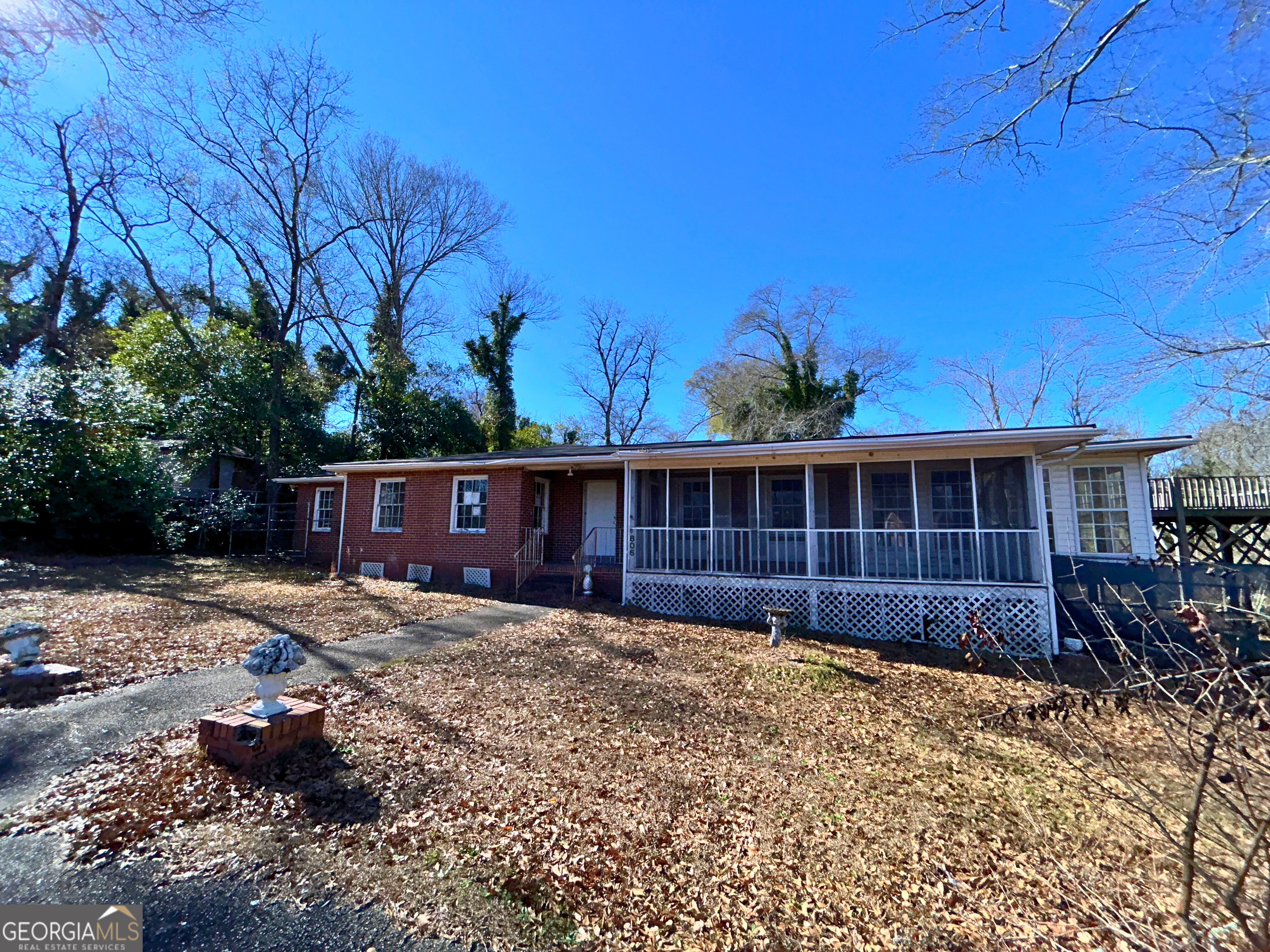 806 Magnolia Drive Macon, GA 31217 - Photo 2 of 25 a view of a house with wooden fence
