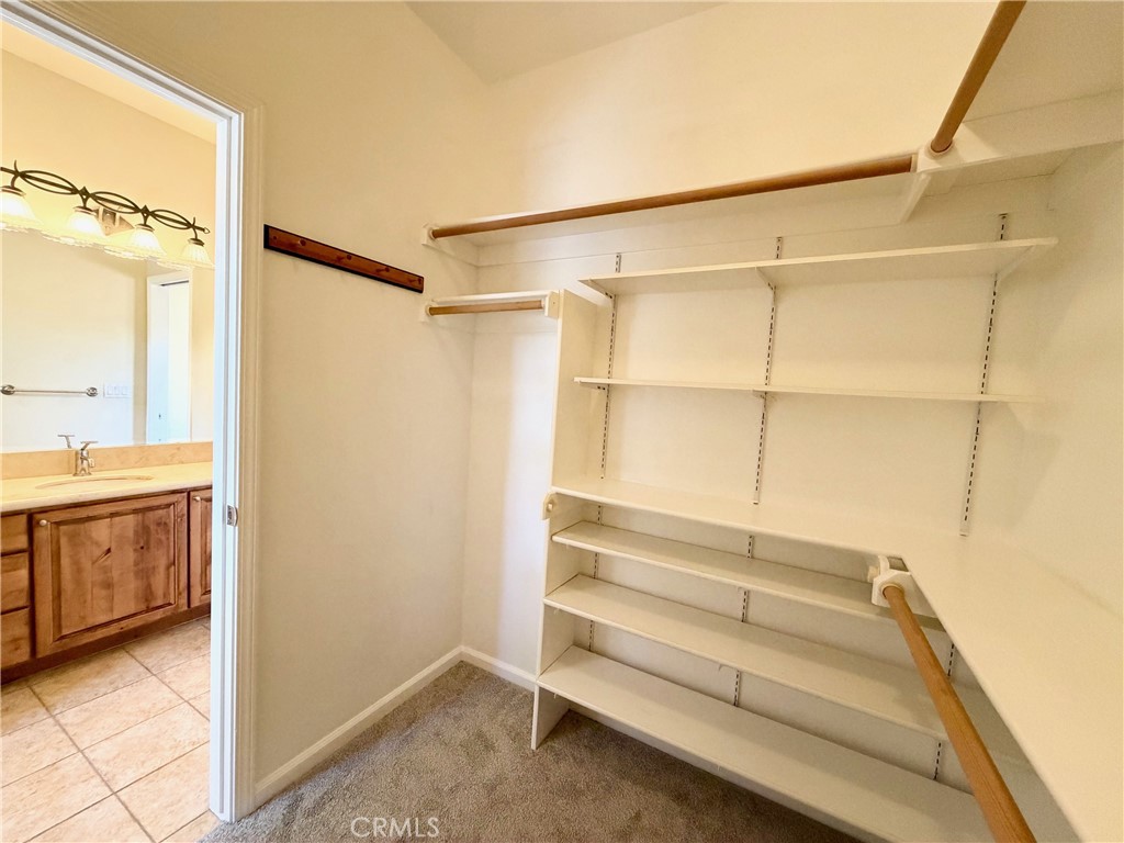 1037 Mark Twain Road Angels Camp, CA 95222 - Photo 33 of 52 a view of walk in closet with empty racks