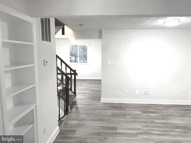 a view of entryway with wooden floor