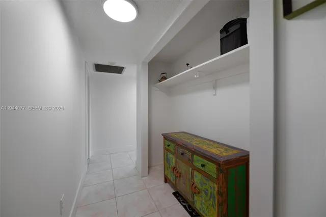 a bedroom with two beds and a window