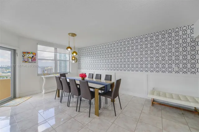 a view of a dining room with furniture and chandelier