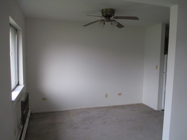 918 Ridge Square, Unit 205 Elk Grove Village, IL 60007 - Photo 4 of 7 an empty room with a window