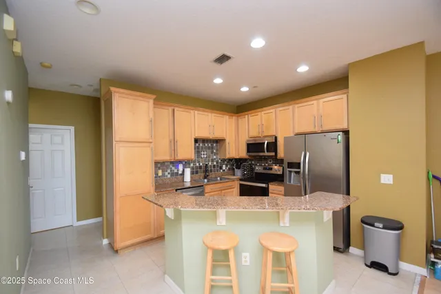 a bed room with a bed and a chandelier