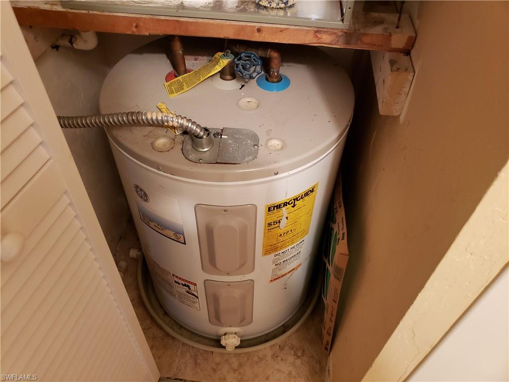 4031 Ice Castle Way, Unit 3303 Naples, FL 34112 - Photo 12 of 18 a utility room with washer and dryer