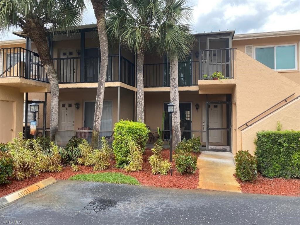 4031 Ice Castle Way, Unit 3303 Naples, FL 34112 - Photo 15 of 18 front view of a house with a small yard