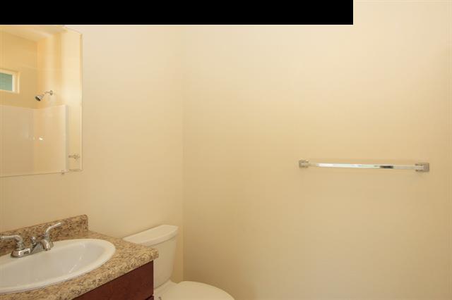 11 Maha Road, Unit 11 Makawao, HI 96768 - Photo 14 of 20 a bathroom with a sink and a mirror
