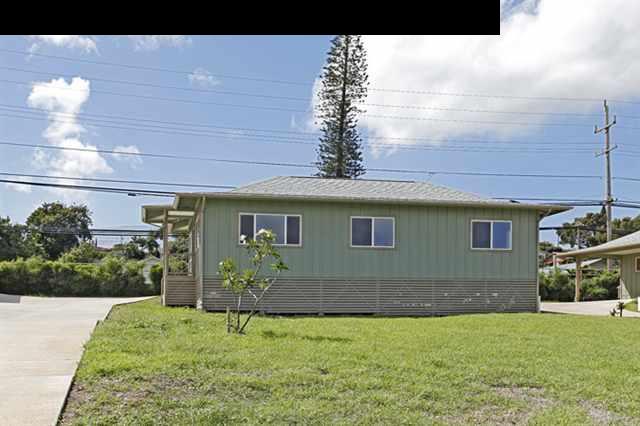 11 Maha Road, Unit 11 Makawao, HI 96768 - Photo 19 of 20 a backyard of a house with table and chairs