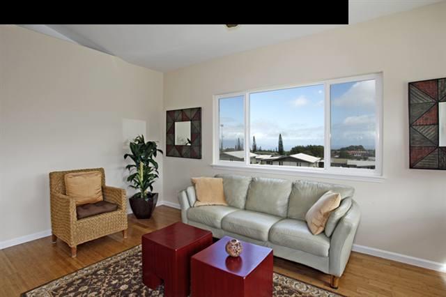 11 Maha Road, Unit 11 Makawao, HI 96768 - Photo 4 of 20 a living room with furniture and wooden floor