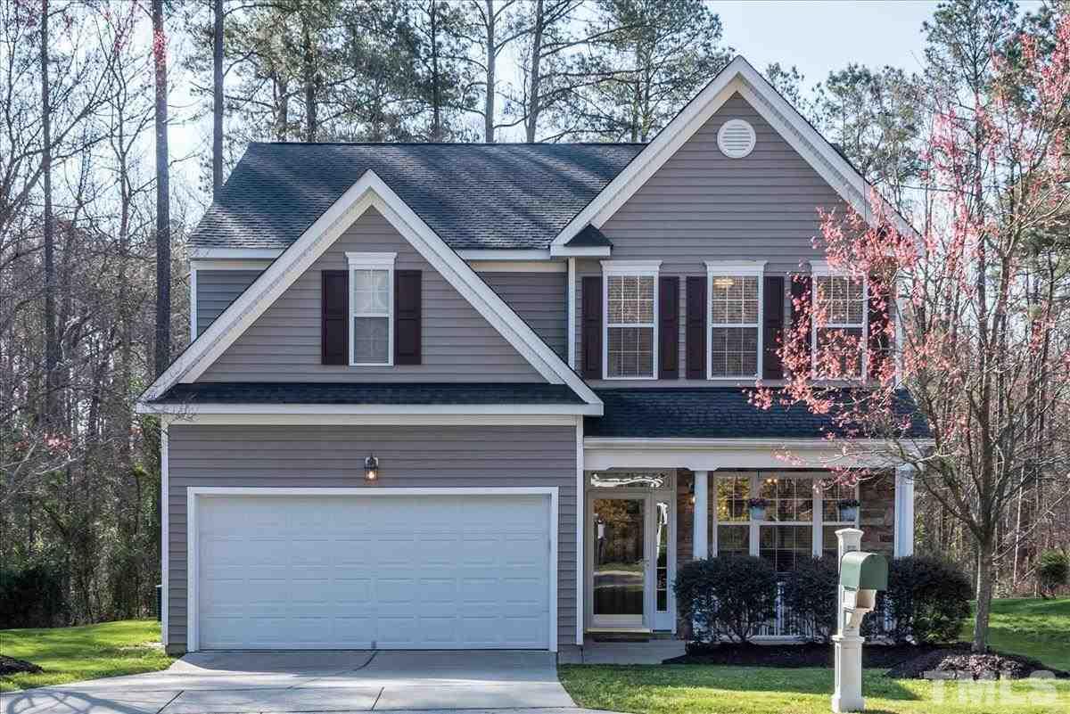7724 Braefield Drive Raleigh, NC 27616 - Photo 1 of 27 a front view of a house with a yard