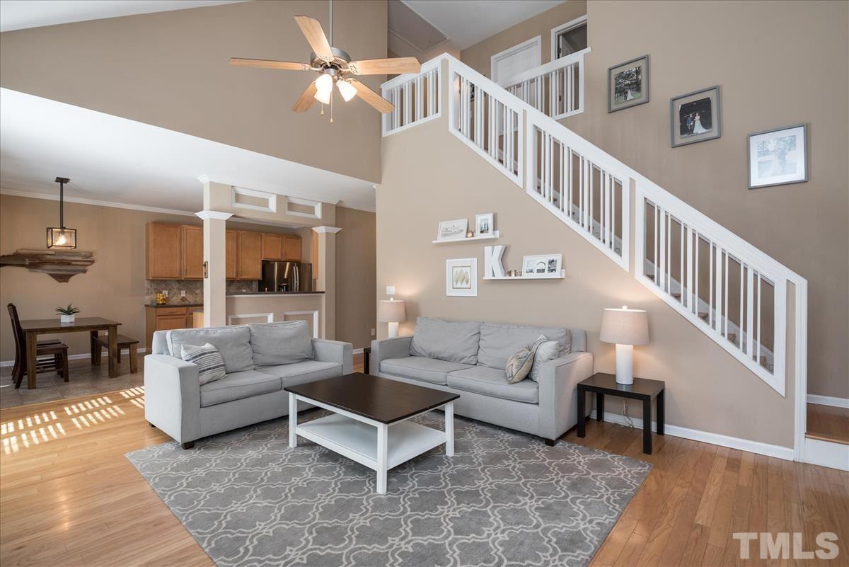 7724 Braefield Drive Raleigh, NC 27616 - Photo 15 of 27 a living room with furniture and a chandelier