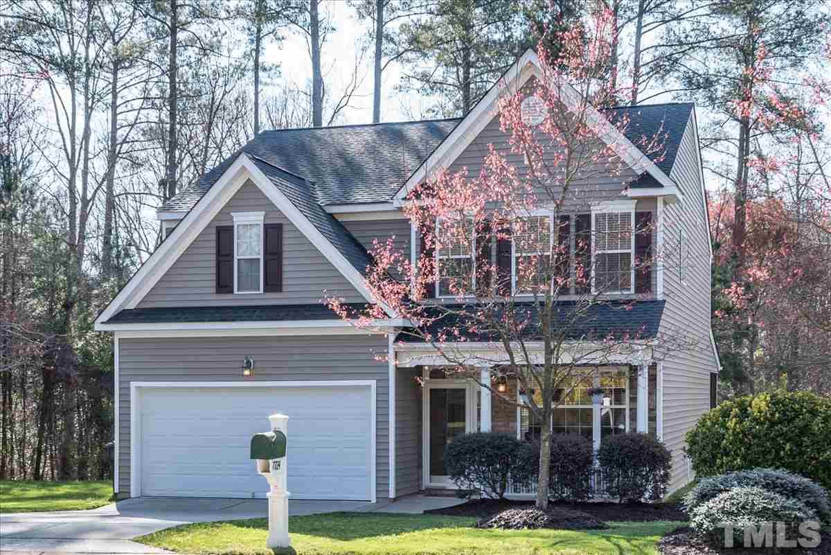 7724 Braefield Drive Raleigh, NC 27616 - Photo 3 of 27 a front view of a house with a yard