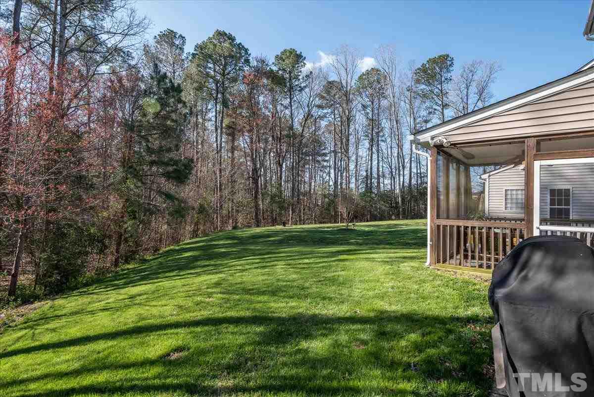 7724 Braefield Drive Raleigh, NC 27616 - Photo 25 of 27 a view of a house with backyard and porch