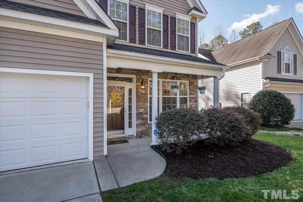 7724 Braefield Drive Raleigh, NC 27616 - Photo 4 of 27 a view of a house with a garden