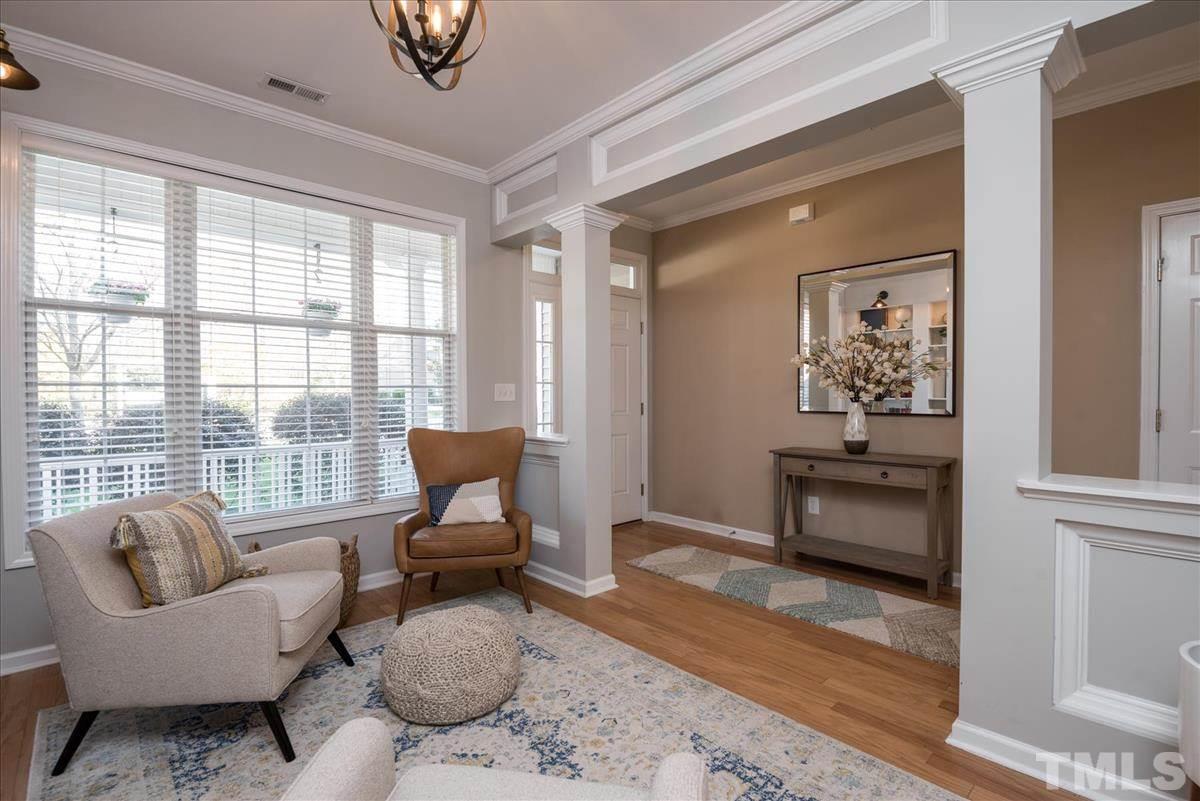 7724 Braefield Drive Raleigh, NC 27616 - Photo 7 of 27 a living room with furniture and a window