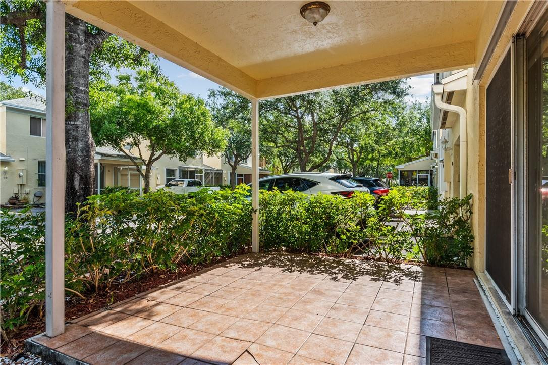 11030 Palm Ridge Lane, Unit 17 Tamarac, FL 33321 - Photo 26 of 32 Covered back patio