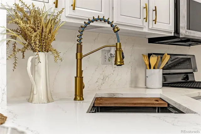 a kitchen with a table chairs and a refrigerator