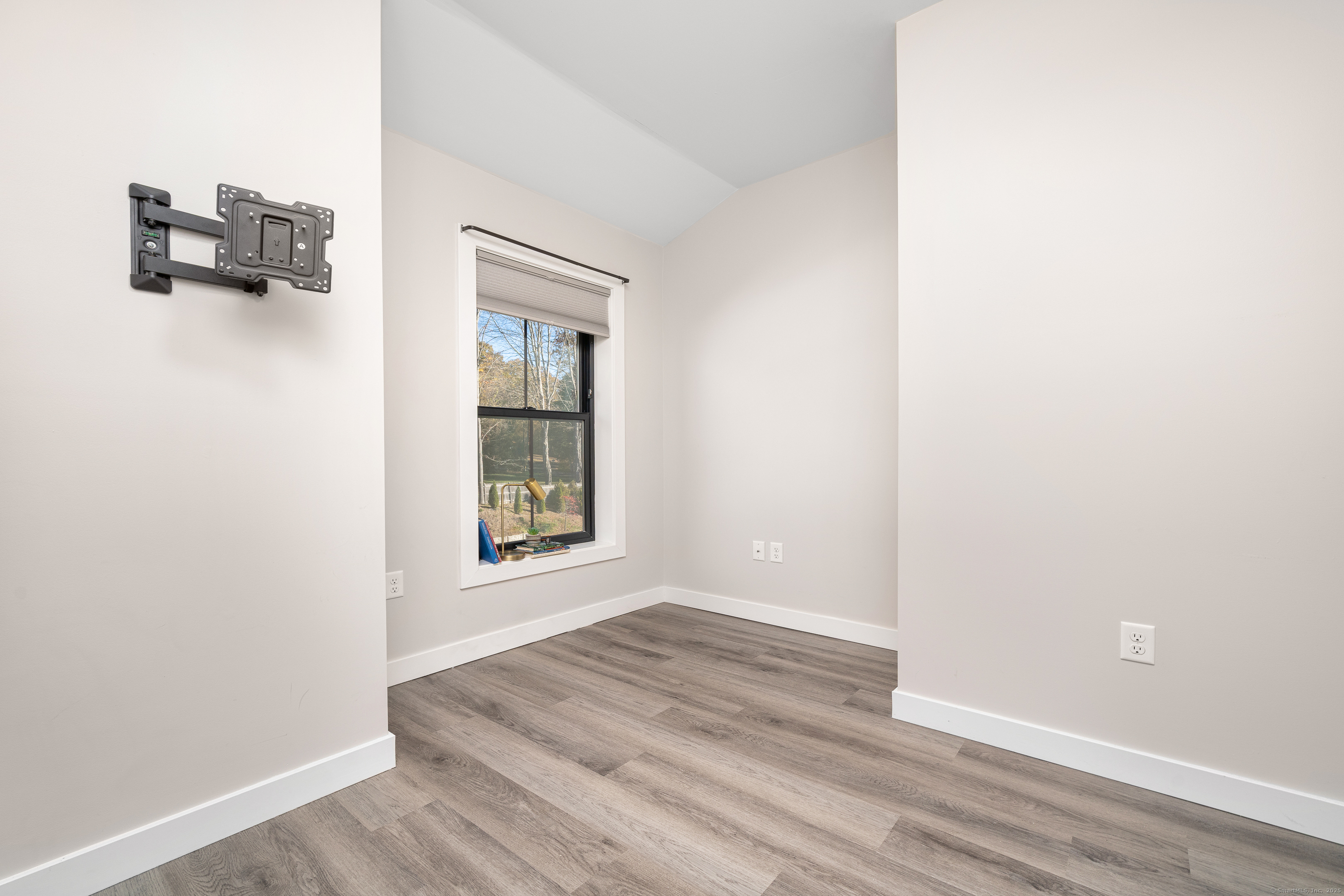 401 Albany Turnpike, Unit 201 Canton, CT 06019 - Photo 14 of 22 a view of an empty room with wooden floor and a window
