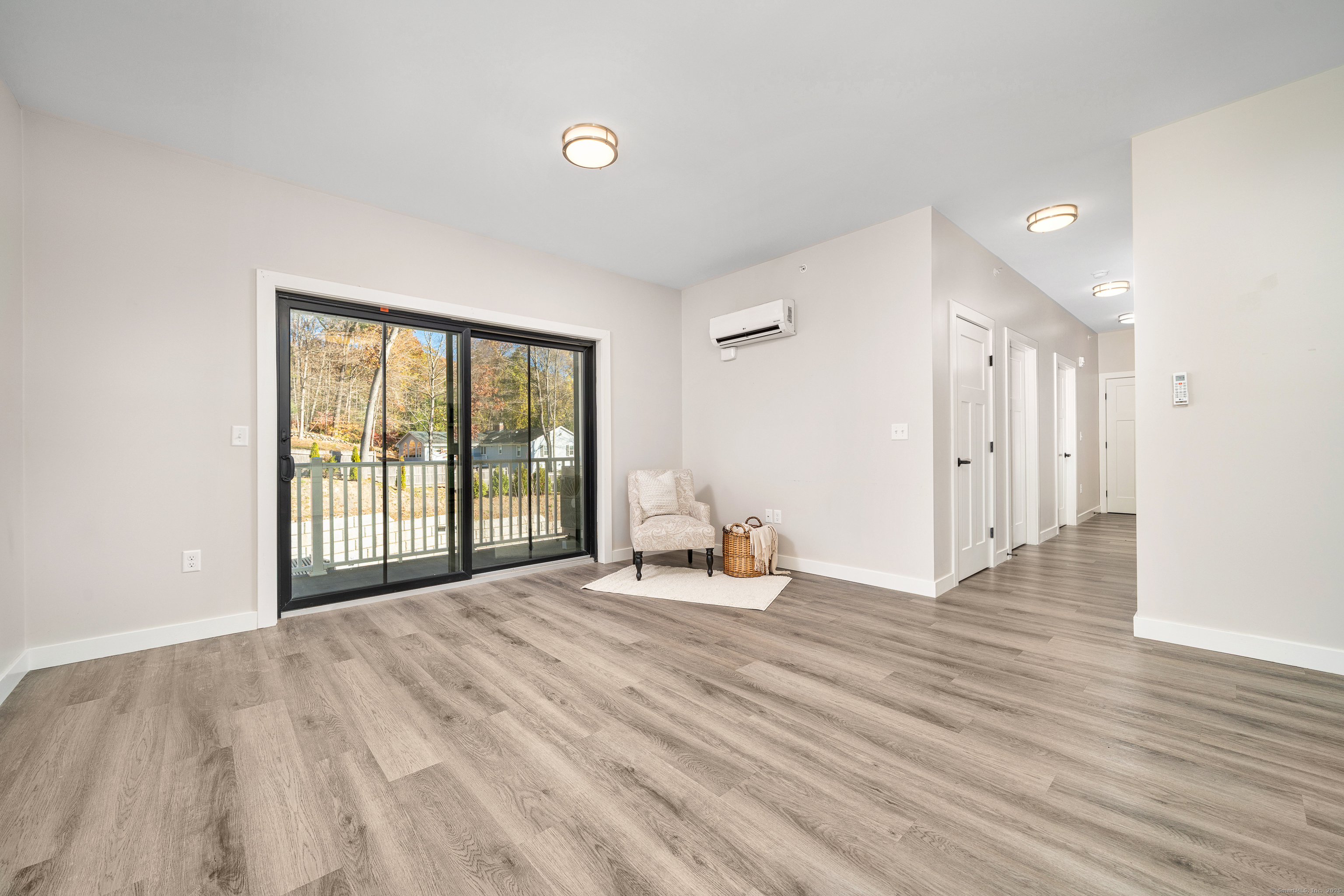 401 Albany Turnpike, Unit 201 Canton, CT 06019 - Photo 5 of 22 a view of an empty room with wooden floor and a window