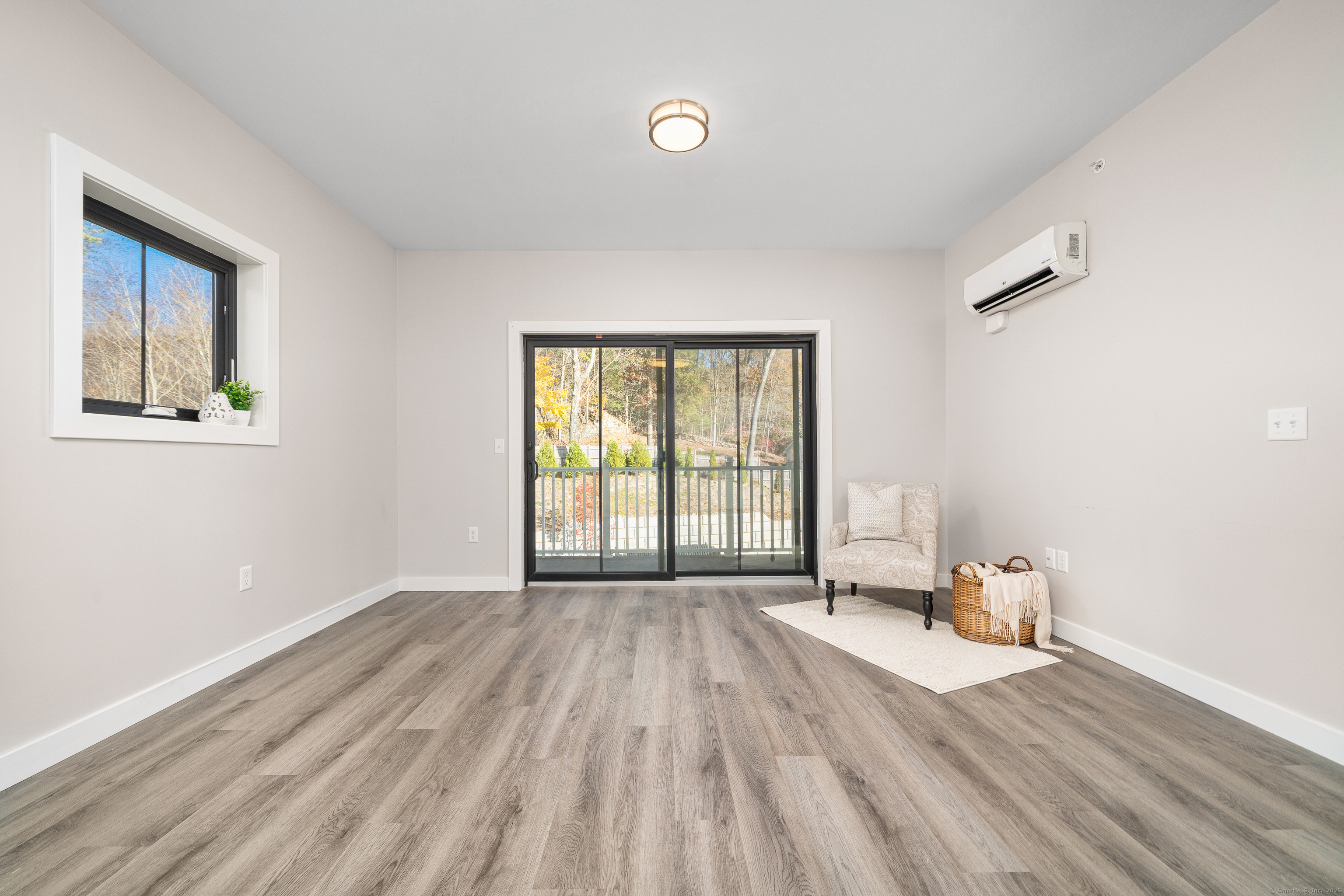 401 Albany Turnpike, Unit 201 Canton, CT 06019 - Photo 6 of 22 a view of an empty room with wooden floor and a window
