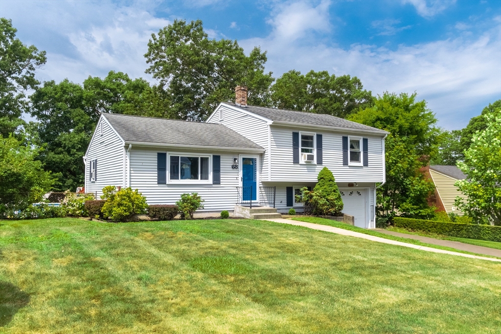 68 Sawmill Road Springfield, MA 01118 - Photo 1 of 25 a front view of a house with a yard