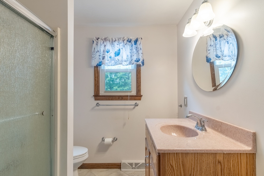 68 Sawmill Road Springfield, MA 01118 - Photo 12 of 25 a bathroom with a sink and a mirror